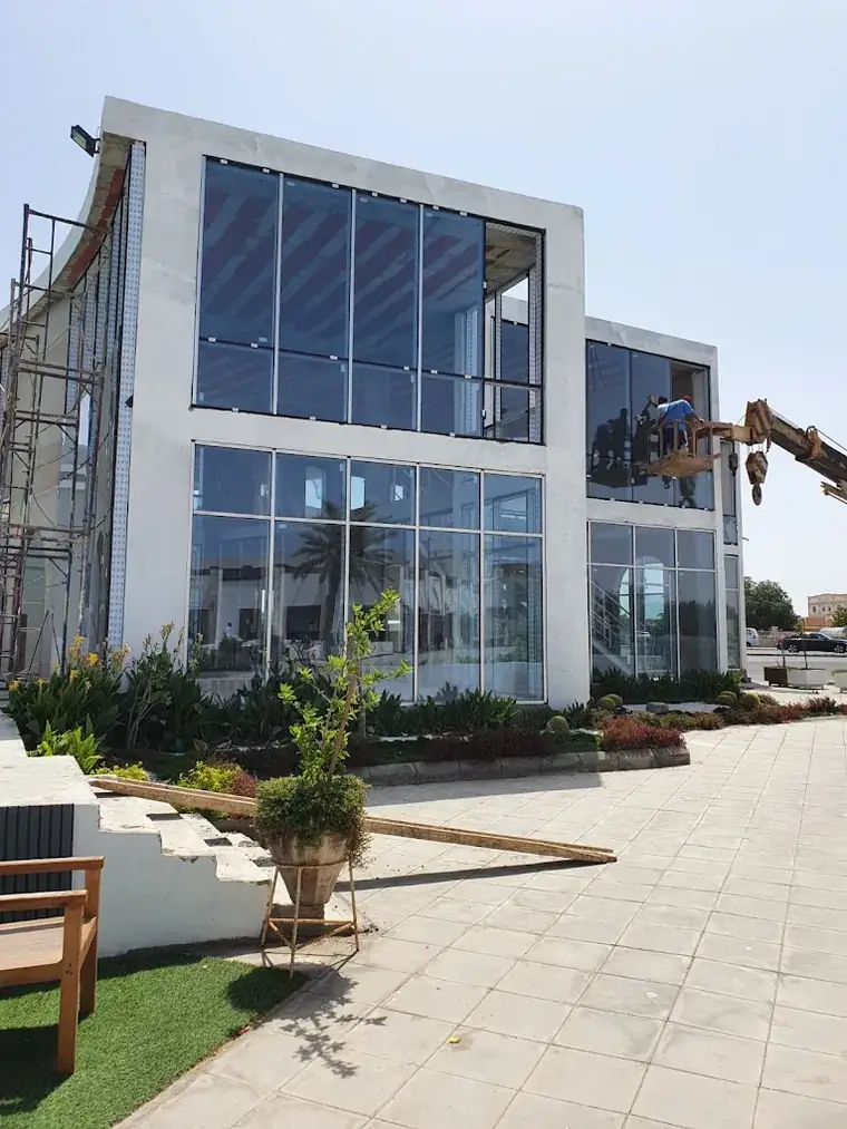 Glass facade of a building with an outdoor garden
